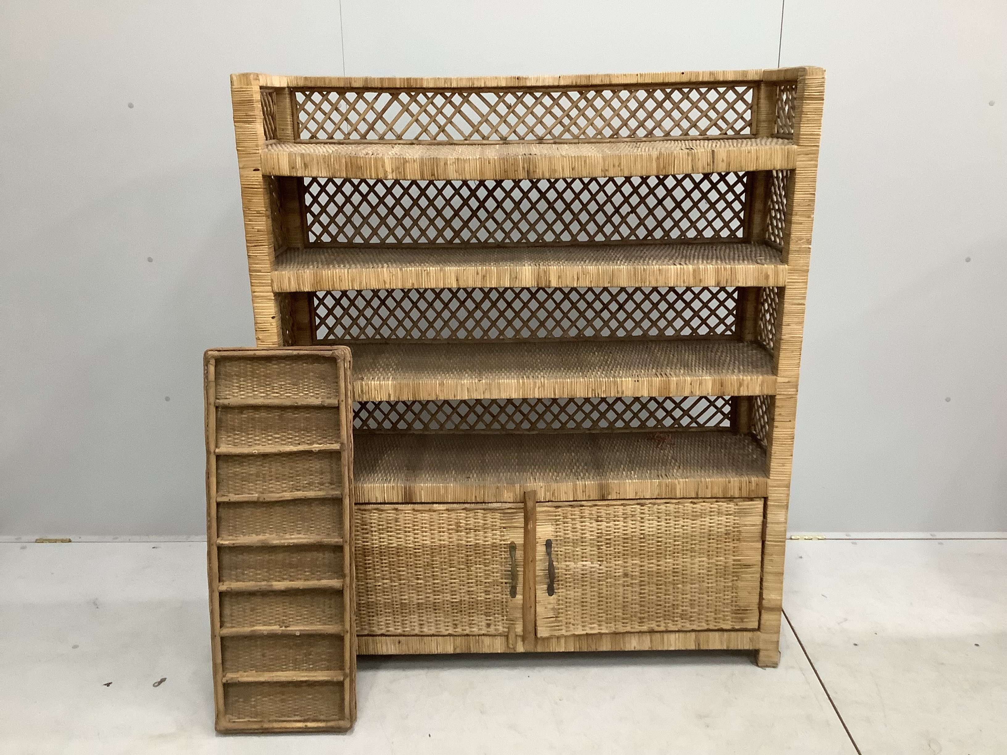 A wicker four tier shelf unit, width 121cm, depth 36cm, height 140cm, together with a wicker eight division tray